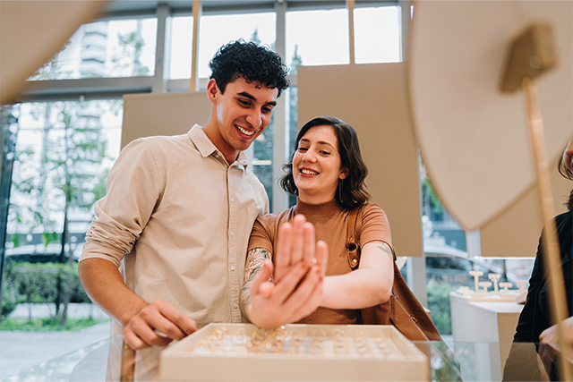 young couple looking at rings